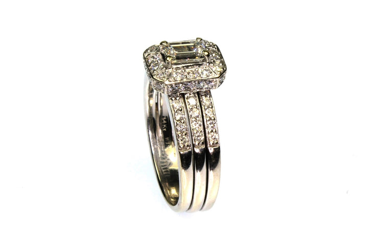 .50ct Emerald Cut Center with a 1.10ctw Diamond Halo Setting